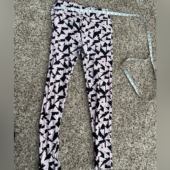 Incredibly unique paper airplane leggings. Great condition. - Picture 3 of 6